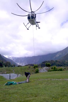 Helicopter slings load into camera site
