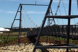 PTZ camera mounted on very top of suspension bridge at Pegasus Town in Canterbury